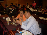Chinese educators discuss physics concepts at Riendeau's session